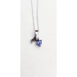 A 14CT WHITE GOLD TRILLION CUT TANZANITE TRACE CHAIN NECKLACE, a