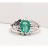 A 9CT WHITE GOLD EMERALD SOLITAIRE ART DECO STYLE VINTAGE RING, a