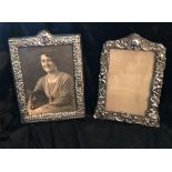 A PAIR OF SILVER PHOTO FRAMES, (i) with cherubs and repoussé deta