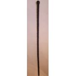 A RARE IRISH 19TH CENTURY CARVED BOG OAK WALKING STICK, with carv