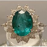 AN 18CT WHITE GOLD SUPERB COLUMBIAN EMERALD RING, 5.20cts surroun