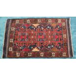 A GOOD QUALITY HAND KNOTTED AFGAN BALUCH WOOL RUG, 147cm x 90cm a