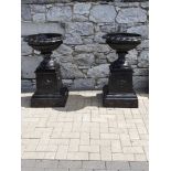 A PAIR OF GARDEN URNS, black, 3ft tall approx.