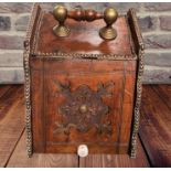 A 20TH CENTURY LIFT TOP OAK COAL / WOOD BOX with turned handle