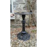 A GOOD HEAVY CAST IRON BIRD BATH, with little bird resting, raise