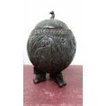 A 19TH CENTURY CARVED COCONUT SHELL, a carved lid with bird head