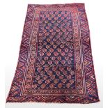 AN ANTIQUE AFGHAN RUG, Afghanistan, featuring central repeat meda