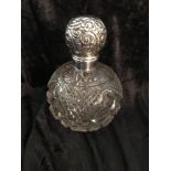 AN EARLY 20TH CENTURY HOBNAIL CUT GLASS PERFUME BOTTLE, with silv