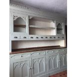 A COUNTRY HOUSE DRESSER, with two cabinets flanking a central she