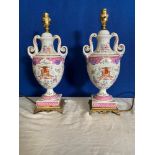 A PAIR OF PORCELAIN URN LAMPS, with floral and crest decorated bo