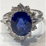 AN 18CT WHITE GOLD EXQUISITE TANZANITE RING, 3.87cts surrounded b