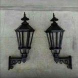 A PAIR OF CAST IRON WALL LIGHTS