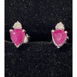 A PAIR OF 14CT WHITE GOLD RUBY & DIAMOND STUD EARRINGS, pear shap