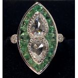 AN 18CT WHITE GOLD ART DECO PERIDOT AND DIAMOND RING, the two cen