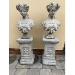 A PAIR OF STONE GARDEN ORNAMENTS, in the form of female busts, on stone bases, 92cm tall approx