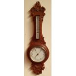 A GOOD 19TH CENTURY CARVED OAK ANEROID WALL BAROMETER, banjo shaped, with carved design of foliage
