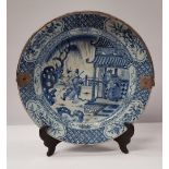 A LARGE 18TH CENTURY BLUE & WHITE CHARGER, with later added engraved silver swing handle, the