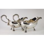 A FINE PAIR OF IRISH SILVER GRAVY BOATS, Dublin, 1977, by George Bellew, with scalloped rim having a
