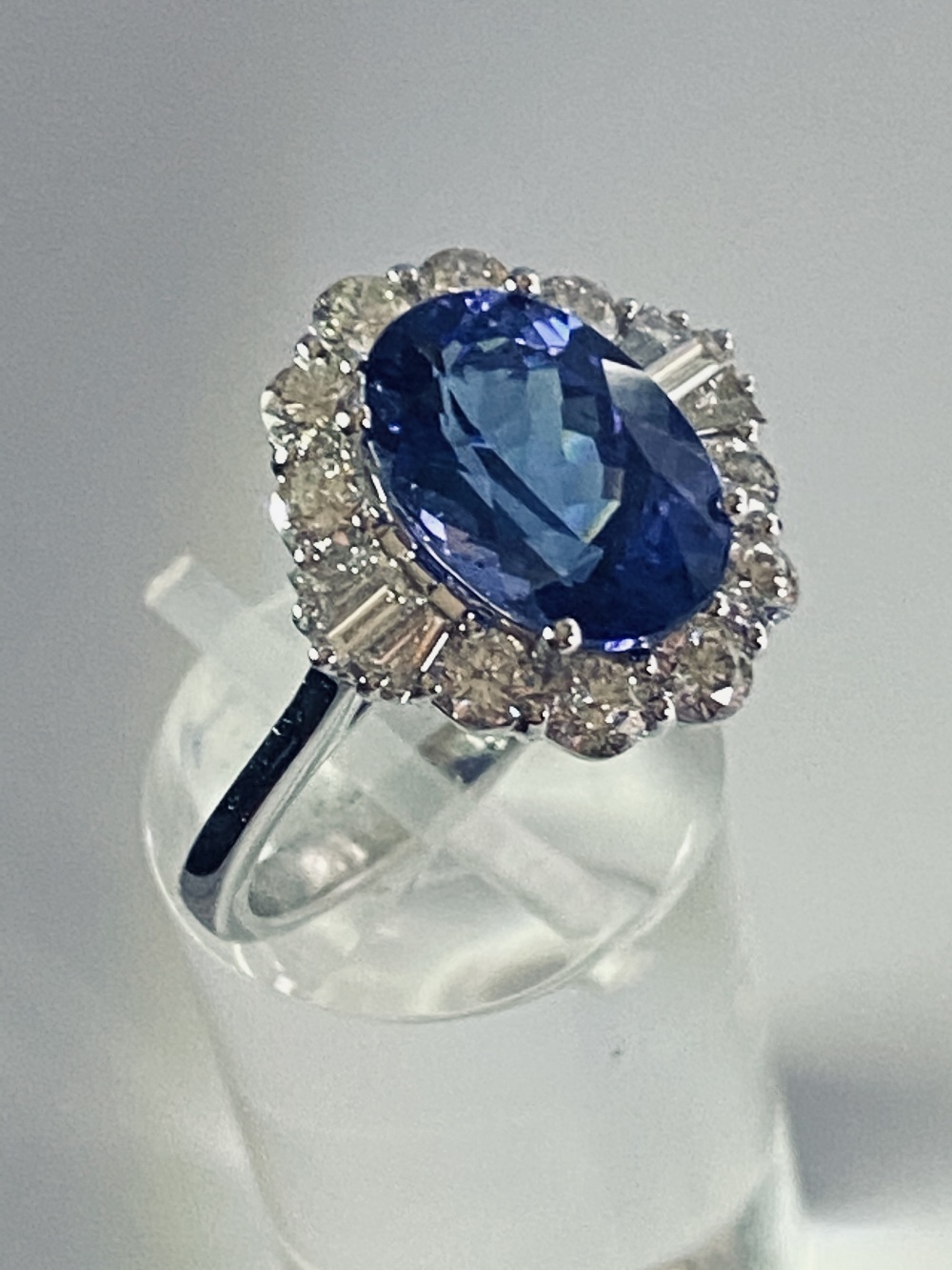 AN 18CT WHITE GOLD ART DECO STYLE TANZANITE AND DIAMOND CLUSTER RING, the superb oval shaped - Image 12 of 12