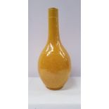 A YELLOW-GLAZED INCISED DRAGON BOTTLE VASE, decorated with images of dragons to the body and