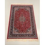 A CLASSICAL PERSIAN CARPET. Design: this carpet has a red ground and intricate floral motifs in