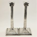 A PAIR OF 18TH CENTURY GEORGIAN SILVER CANDLESTAICKS, London, 1765, by Ebenezer Coker, Corinthian