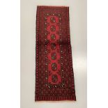 A BOKHARA DESIGN RUG, hand woven by Tribesmen from the Northern Provinces of Afghanistan in the