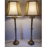 A GOOD QUALITY PAIR OF 19TH CENTURY BRASS GOTHIC STYLE CANDLESTICK TABLE LAMPS, former