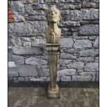 A SANDSTONE GARDEN ORNAMENT OF A BUST OF SALVADOR DALÍ set on a column support, 66 inches tall