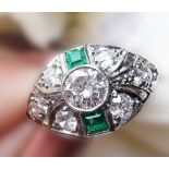 A BEAUTIFUL ART DECO PLATINUM EMERALD AND DIAMOND EYE SHAPED RING, with the finest of gemstones,