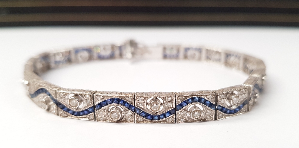 A STUNNING 18CT WHITE GOLD DIAMOND AND SAPPHIRE BRACELET, with round brilliant cut diamonds,