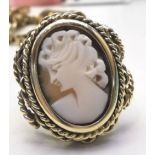 A 9CT YELLOW GOLD VINTAGE CAMEO RING, with decorative rope detail, ring size R. Face of ring: 22.6mm