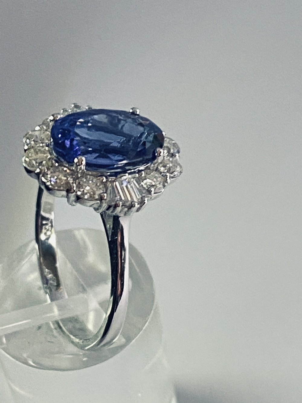 AN 18CT WHITE GOLD ART DECO STYLE TANZANITE AND DIAMOND CLUSTER RING, the superb oval shaped - Image 11 of 12