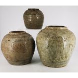 THREE SONG STYLE CHINESE STONEWARE GINGER JARS, each glazed with faded designs, varying sizes –