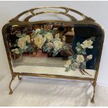 A VICTORIAN BRASS FIRE SCREEN, with painted bevelled mirror, decorated with beautiful roses, 64cm