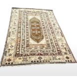 A MID 20TH CENTURY GOOD QUALITY HANDMADE PERSIAN WOOL CARPET, with geometric bordered panels,