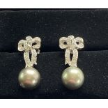 A PAIR OF 18CT WHITE GOLD VINTAGE DIAMOND BOW SHAPED DROP EARRINGS, each with a Tahitian pearl