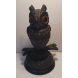 A HANDCARVED 19TH CENTURY BOG OAK OWL, with amber glass eyes, the head detaches, 10.8cm (H) x 5.