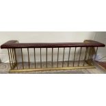 A GOOD BRASS CLUB FENDER, with red padded leather seat, good size, 192cm long x 44cm deep x 58cm