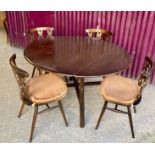 A MID 20TH CENTURY DINING TABLE WITH A SET OF FOUR PRINCE OF WALES FEATHER BACK CHAIRS, possibly