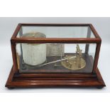 A GOOD QUALITY EARLY 20TH CENTURY CASED BAROGRAPH, brass engraved with J W Butler Optician