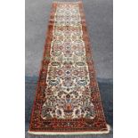 A SAROUK PERSIAN DESIGN PURE WOOL PILE RUNNER, with rightly woven deep pile, circa 1990, a knot
