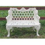 A GOOD QUALITY HEAVY CAST IRON GARDEN SEAT, with linked horse shoe back, double scroll sides with