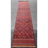 A GENUINE HAND MADE AFGHANISTAN BARGESTA HAND WOVEN WOOL RUG, with hand cut embossed motifs in a