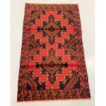 A BELOUCH TRIBAL CARPET, hand woven in the Shindan province of Eastern Afghanistan. Design: