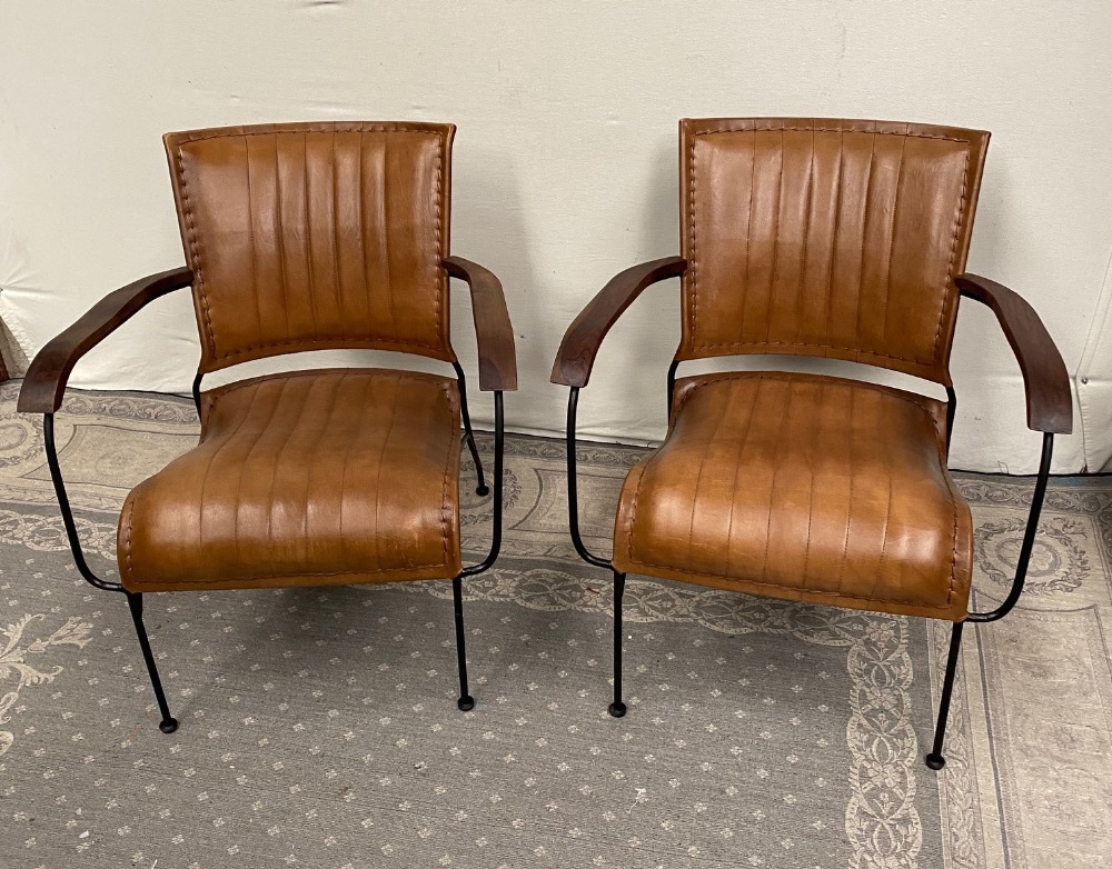 A PAIR OF CONTEMPORARY MID CENTURY MODERN STYLE LEATHER AND METAL ARM CHAIRS, with wooden arm rests,