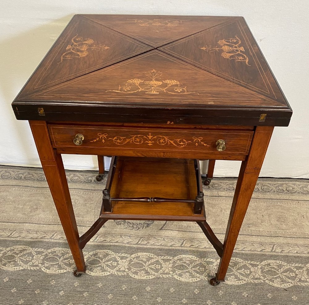 A GOOD QUALITY ROSEWOOD SATINWOOD INLAID ENVELOPE CARD TABLE, top folds out to reveal baize lined