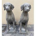 A PAIR OF STONE ORNAMENTS IN THE FORM OF DOGS, 72cm tall approx