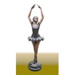 A BRONZE GARDEN ORNAMENT / STATUE OF A BALLERINA, raised on a marble base, 4ft 6 inches tall