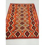 A KELLIM RUG, hand woven by a weaver from the Hazara Tribe of Central Afghanistan in the Bamiyan